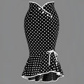 Black and white polka dot midi dress with slim fit fishtail skirt, fitted bodice, three front buttons, and ruffled hem