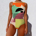 A vibrant sleeveless print lady swimsuit with vintage abstract print in orange, mint green, pink, and cream colors