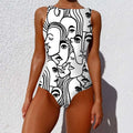 A sleeveless one-piece swimsuit with a bold black and white vintage abstract print of overlapping stylized faces
