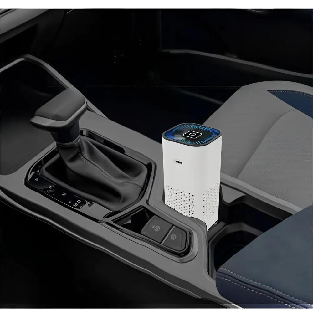 White cylindrical portable car air purifier with blue glowing top and perforated sides featuring negative ion generator