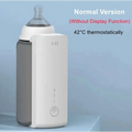 White and gray portable constant temperature baby bottle warmer with usb charging circular control button and temperature indicators
