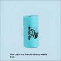 A roll of light blue biodegradable dog poop bags with pet go go branding and black dog illustration in a poop bag dispenser