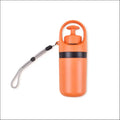 Orange insulated portable dog poop scooper with black pump lid carrying strap and integrated poop bag dispenser