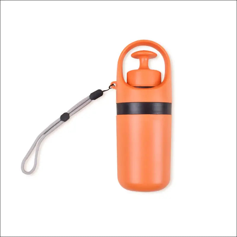 Orange insulated portable dog poop scooper with black pump lid carrying strap and integrated poop bag dispenser