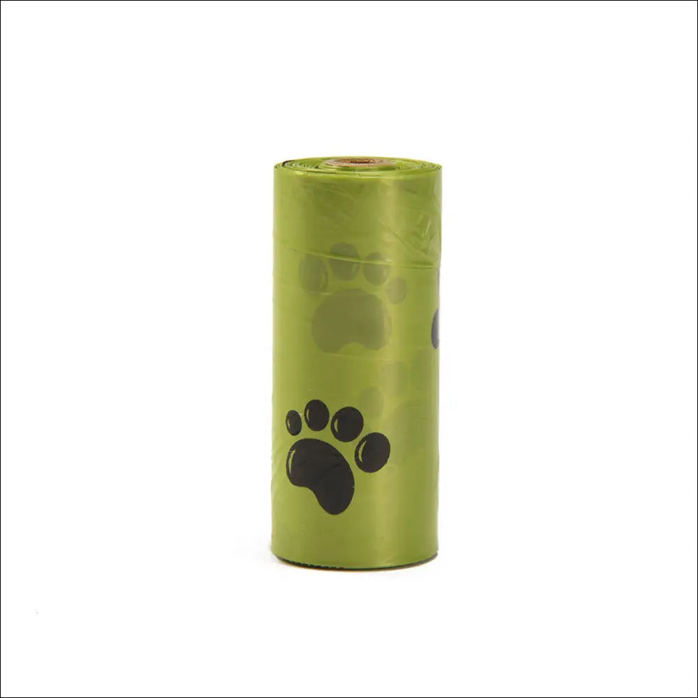 A roll of lime green plastic dog poop bags with black paw prints for a portable poop bag dispenser