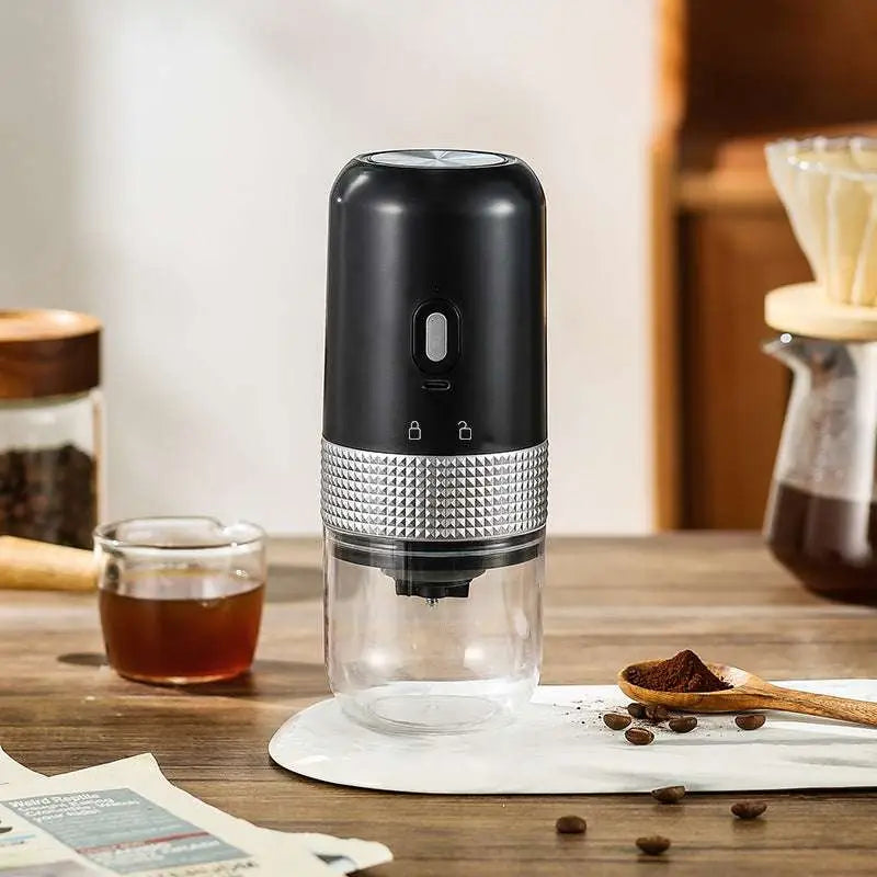 Black and silver portable electric ceramic coffee grinder with usb charging capability and textured metallic band