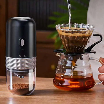 Black and silver portable electric ceramic coffee grinder with usb charging capability and textured metallic band detail