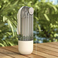 Transparent cylindrical travel toothbrush holder with white base and lid featuring vertical ridges for green dog walking pet water cup