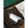 White portable handheld hanging ironing machine with folding handle transparent water tank and charging cable