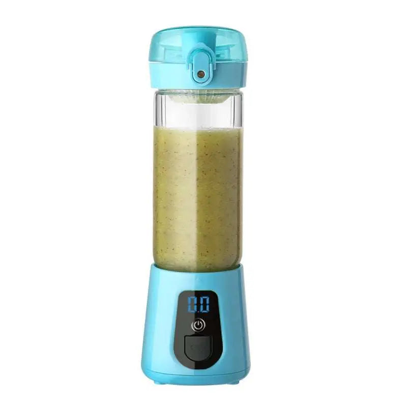 Light blue portable mini electric juice cup blender with transparent cup filled with green smoothie and digital display