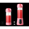 Pink portable mini electric juice cup blender with transparent blending cup and digital display on base