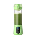 A sleek lime green portable mini electric juice blender with transparent glass container and digital display