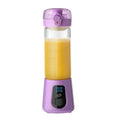 Portable mini electric purple blender with clear glass container filled with orange juice and digital display base