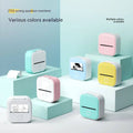 Pastel-colored white portable mini label printer with black lettering thermosensitive sticky paper rolls and small screen