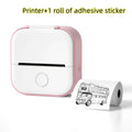 Compact pink and white portable mini label printer with black lettering thermosensitive sticky paper roll and double-decker bus design