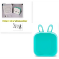 Mint green plastic bunny-shaped portable mini label printer with sticky paper rolls and black lettering thermosensitive printing