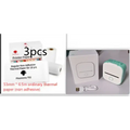 White portable mini label printer with sticky black lettering thermosensitive paper rolls and green and white casing