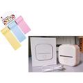Pink and white portable mini label printer with black lettering thermosensitive sticky paper rolls and circular button