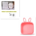 Pink bunny-shaped silicone storage box for white portable mini label printer with black lettering thermosensitive paper rolls