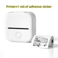 White portable mini label printer with black lettering thermosensitive roll printing a vintage double-decker bus sticker