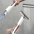 White portable self-squeezing mini mop with absorbent cotton head gray scrubbing head and rose gold accents handheld
