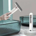 White and gray portable self-squeezing mini mop with absorbent cotton head designed for bathroom use