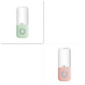Pastel green and pink mini portable blender with glass container and circular button portable usb automatic juicer