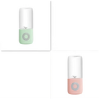 Pastel green and pink mini portable blender with glass container and circular button portable usb automatic juicer