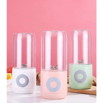 Three portable usb automatic mini juicer cups with clear glass jars and pastel silicone bases in white pink and mint green