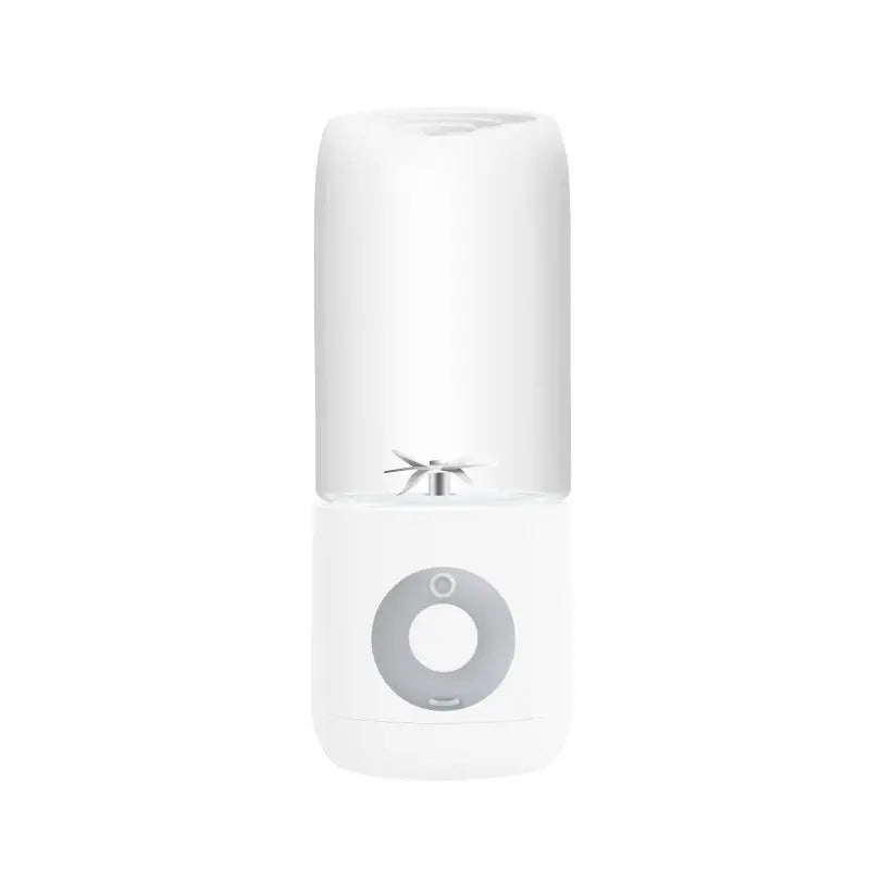 White portable usb automatic mini juicer with transparent upper section and silver blade assembly in glass cups