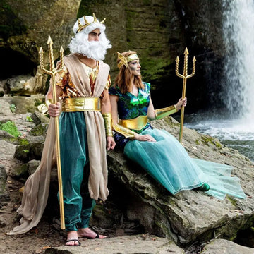 Gold trident held by cosplayer wearing poseidon queen king war costume featuring a gold crown and intricate design