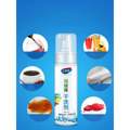 White pump bottle of xinjuke powerful stain and grease cleaning spray with green and blue labeling for pink puffer jacket fur-lined hood