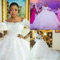White off-the-shoulder pregnant women princess wedding dress with lace sleeves and floral lace detailing long sleeves