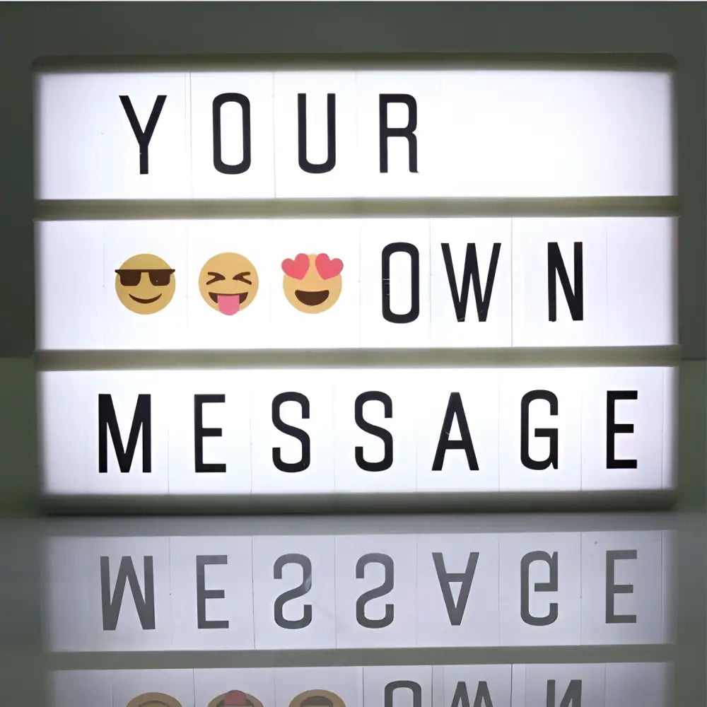 A premium led cinema lightbox with glowing white panels and black letter tiles spelling your own message with emojis