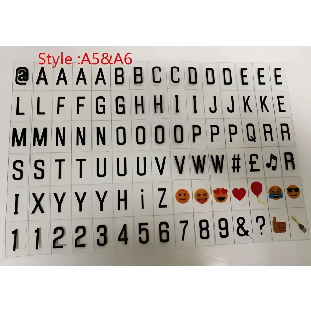 Black plastic letter and emoji stickers in a grid for premium led cinema lightbox featuring letters numbers symbols and colorful emojis