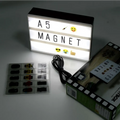 White premium led cinema lightbox featuring black letters and emoji symbols on an illuminated letterboard magnet