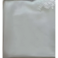 A delicate white lace-trimmed satin pillowcase with smooth texture complements the princess bride mermaid dress