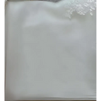 A delicate white lace-trimmed satin pillowcase with smooth texture complements the princess bride mermaid dress
