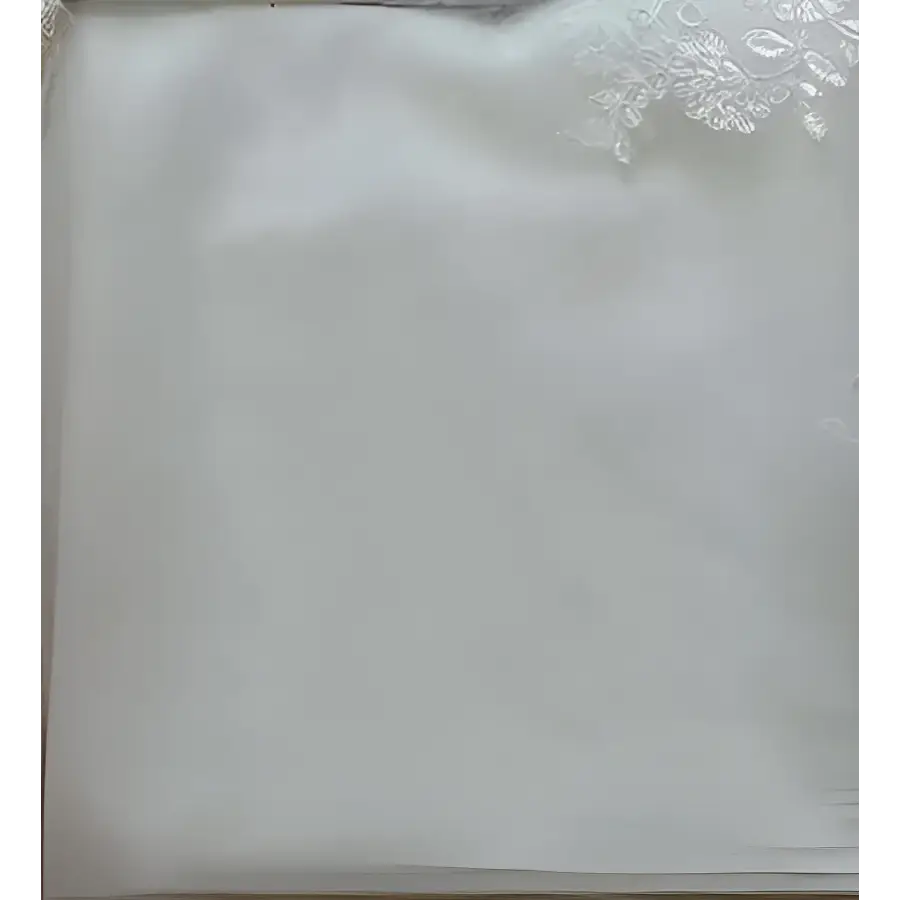 A delicate white lace-trimmed satin pillowcase with smooth texture complements the princess bride mermaid dress