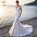 White lace princess bride mermaid wedding dress with off-the-shoulder sleeves and flowing train for brides