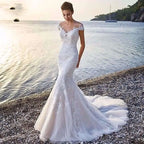 White lace princess bride mermaid wedding dress with off-the-shoulder sleeves and flowing train for brides