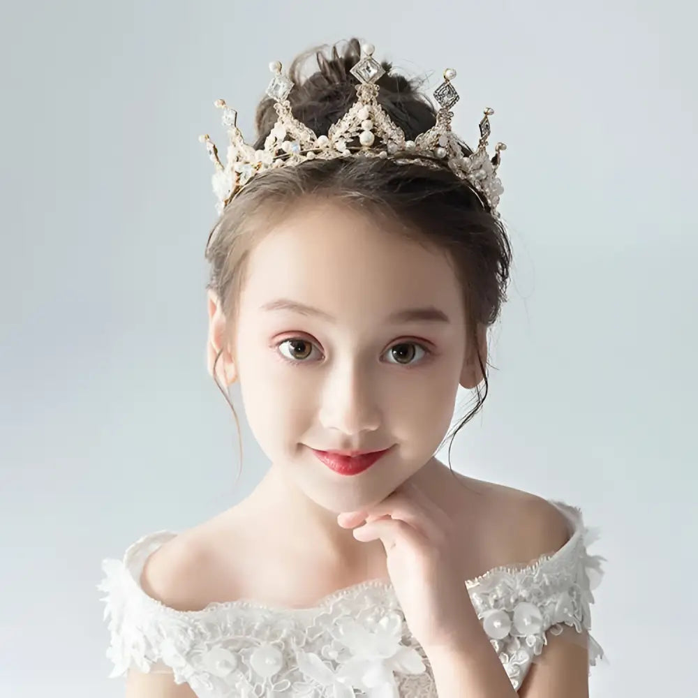 A delicate silver princess girl diamond crown crystal headband adorned with sparkling crystals and intricate filigree