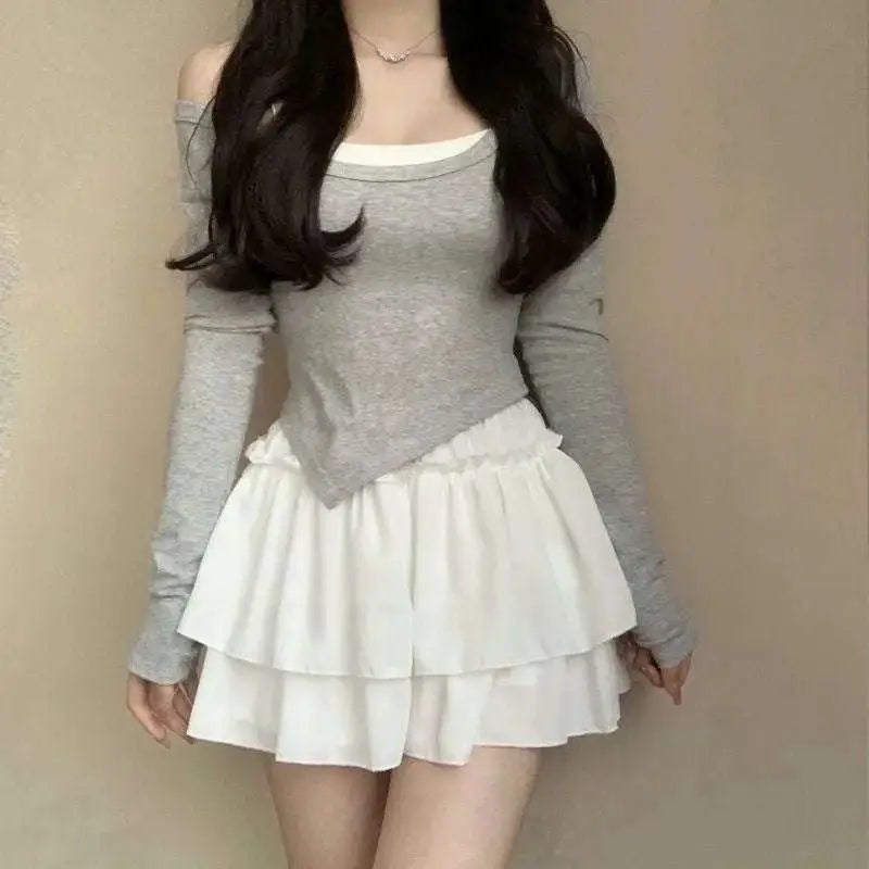 Gray long-sleeved off-the-shoulder top with white lining and asymmetrical hemline paired with pure desire style slimming ballet skirt