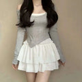 Gray long-sleeved off-the-shoulder top with white lining and asymmetrical hemline paired with pure desire style slimming ballet skirt