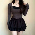 Black pure desire style slimming ballet skirt with ruffled mini length, gathered waistband, and layered pleats