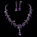 Elegant purple crystal wedding necklace and earring set with cascading teardrop and clustered amethyst stones
