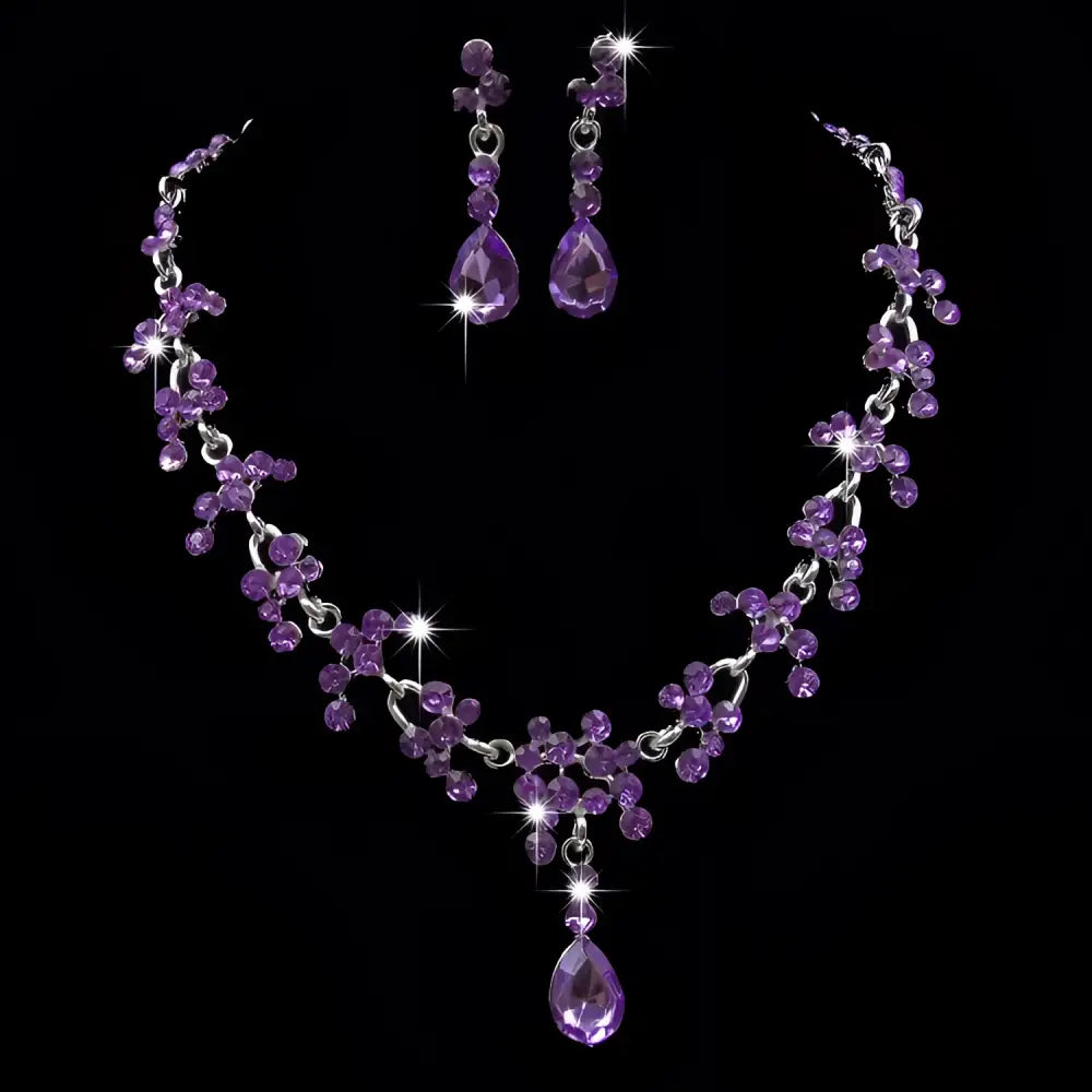 Elegant purple crystal wedding necklace and earring set with cascading teardrop and clustered amethyst stones