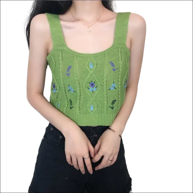 A vibrant green knitted embroidered floral camisole with intricate cable knit patterns and purple blue floral motifs