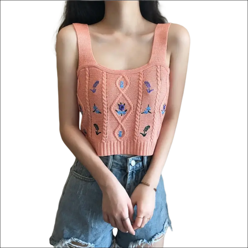 A peach knitted embroidered floral camisole with blue floral embroidery and diamond cable knit design