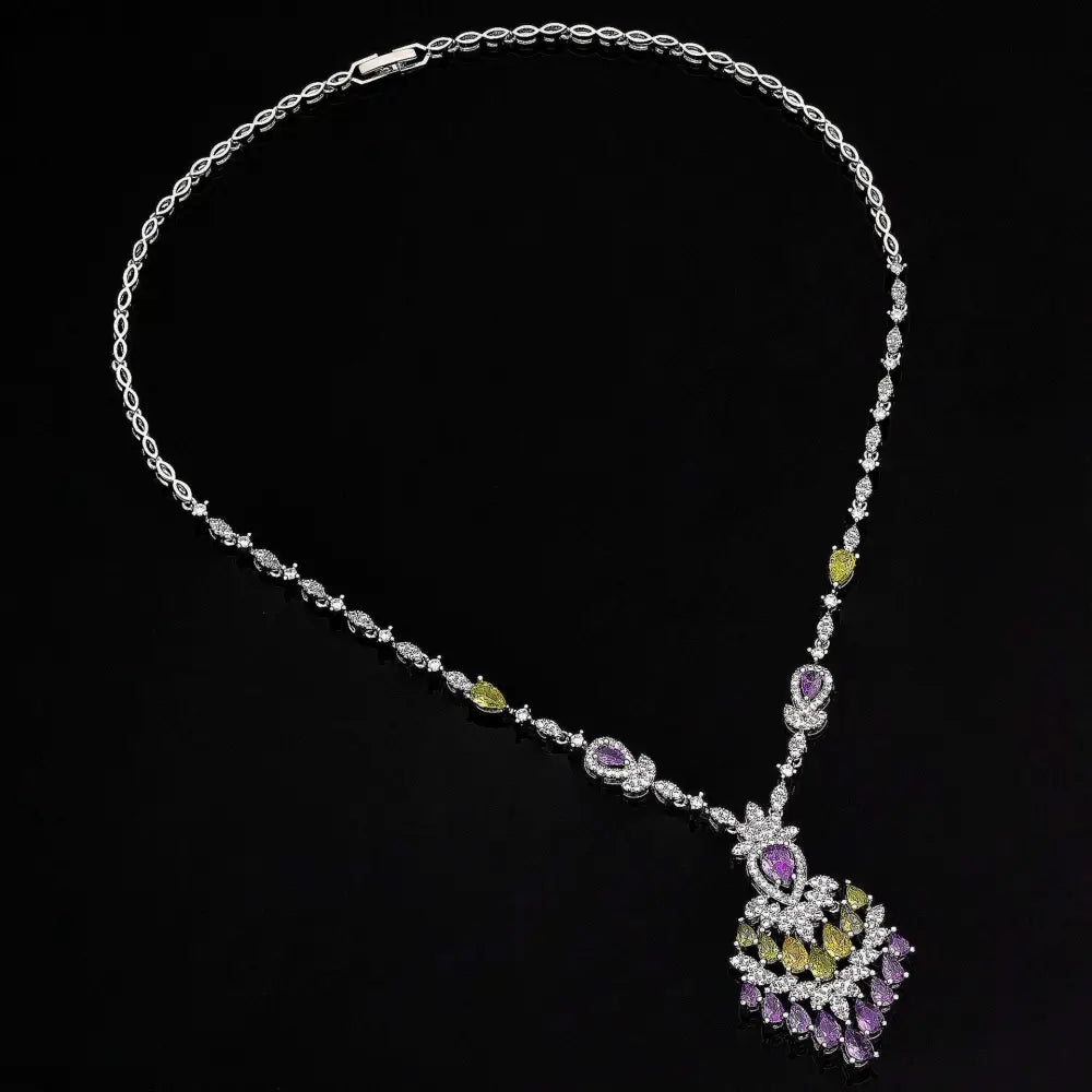 Elegant silver-toned purple floral color zirconium necklace earrings set with green and purple gemstone accents